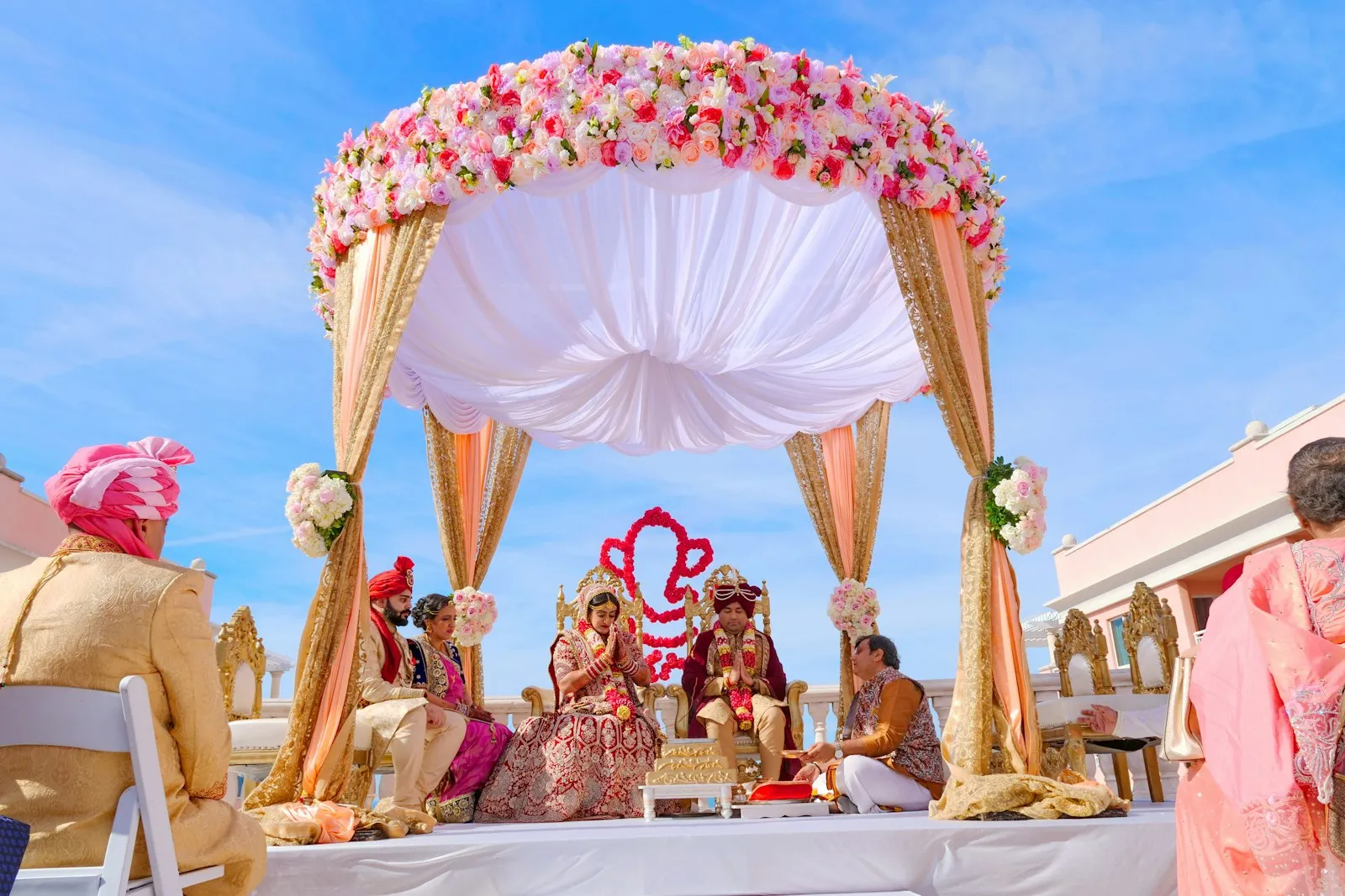 Wedding ceremony under a floral canopy